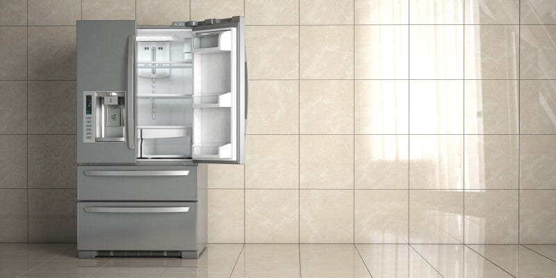 Modern silver American-style fridge freezer Northern Ireland homes love, shown with doors open in a contemporary tiled kitchen.