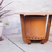 Wooden outdoor fire pit table with a rustic design on a patio.