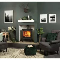 Modern living room with a fireplace, gray sofa, and decorative items.