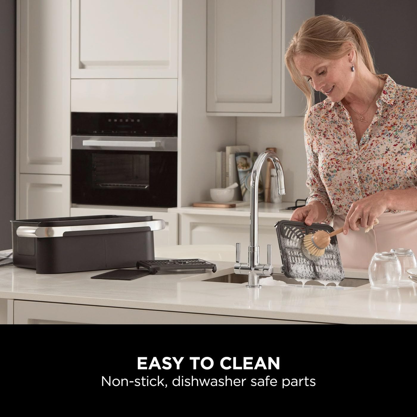 Woman cleaning kitchen counter with text 'Easy to Clean' and 'Non-stick, dishwasher safe parts'.