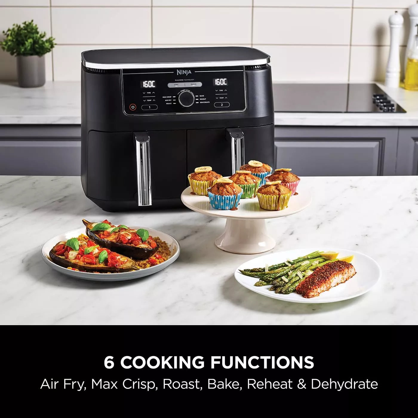 Ninja foodi air fryer with cooked foods on a kitchen counter
