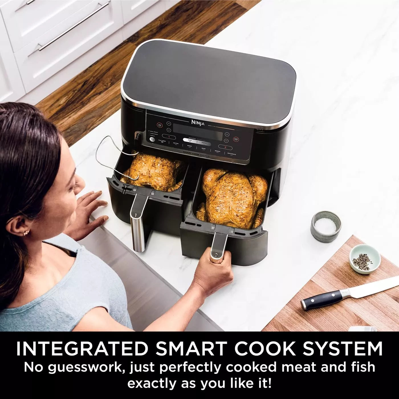 Woman using a Ninja air fryer with perfectly cooked food, kitchen setting.