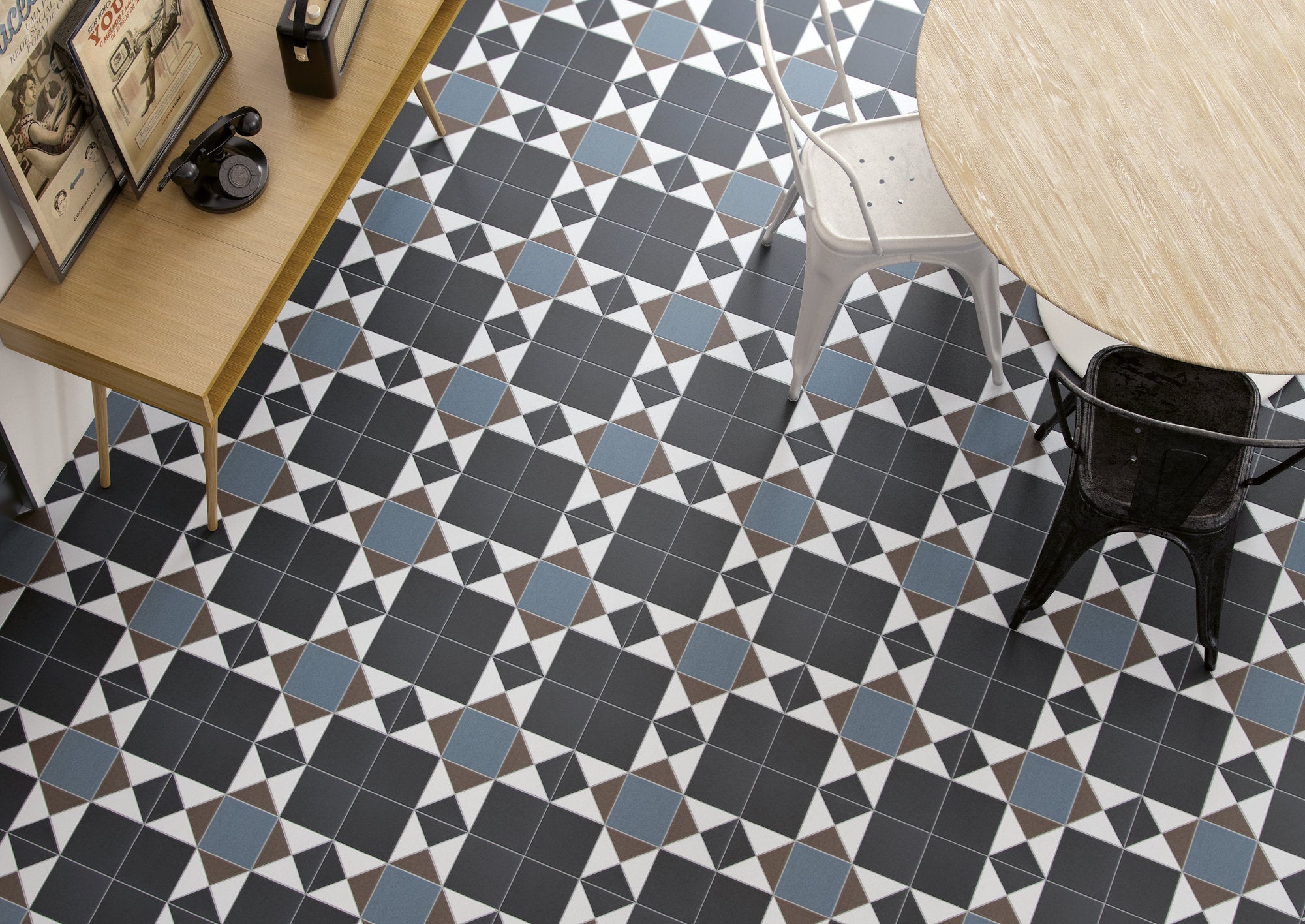 Patterned tile floor with a wooden table and chair in a room setting.