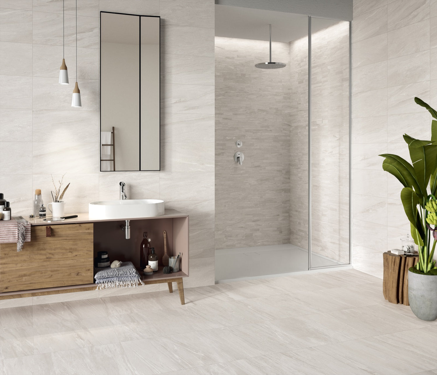 Modern bathroom with wooden vanity, mirror, and shower area.