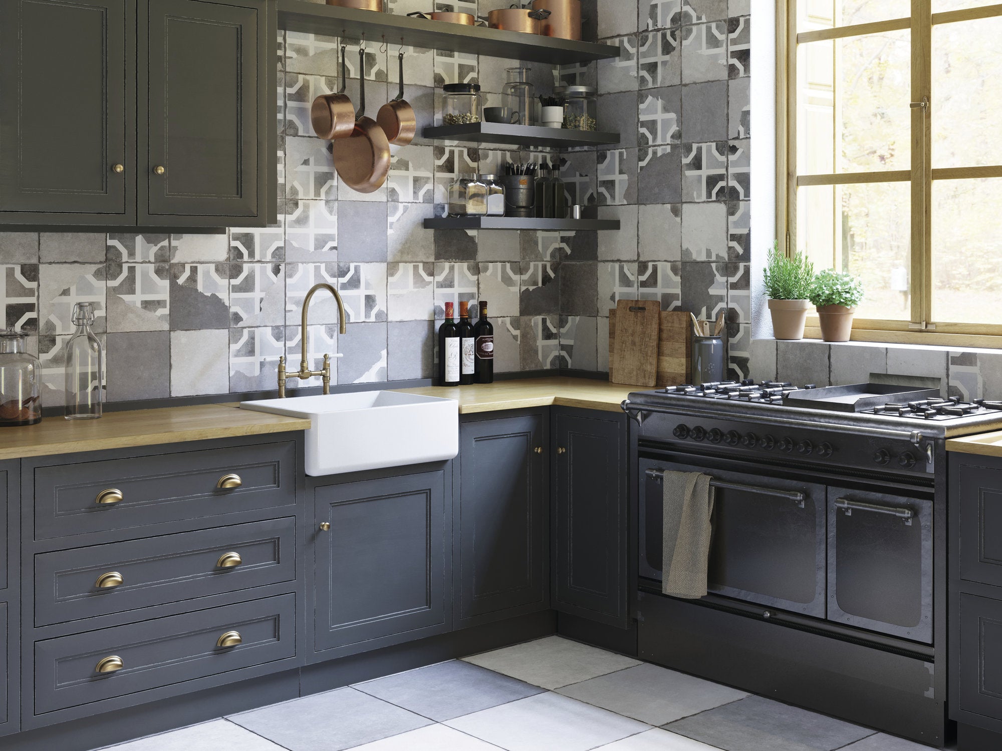 Modern kitchen with gray cabinets, white sink, and black stove.